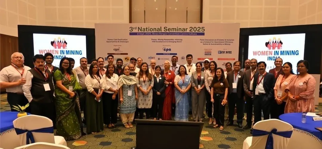 Attendees in front of the 3rd National Seminar 2025 backdrop in Kolkata, with Women In Mining India shown on the screens